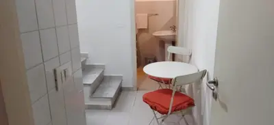 a small bathroom with a stool and a sink at LA CASA DI ALISIA Palermo Centro in Palermo