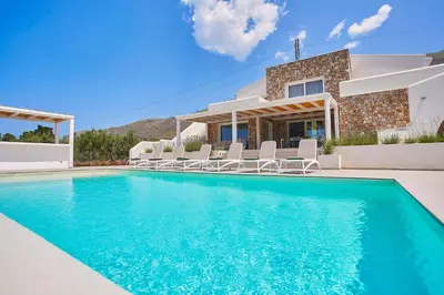 a villa with a swimming pool in front of a house at Villa Allegra in Castellammare del Golfo