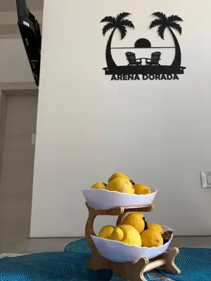 two plates of lemons on a stand with a sign at Arena Dorada apartaments Margarita in Balestrate