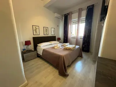 a bedroom with a bed and a window at My Space in Palermo