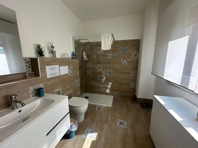 a bathroom with a toilet and a sink at My Space in Palermo