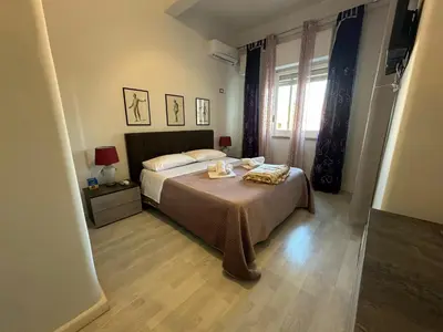 a bedroom with a bed and a window at My Space in Palermo