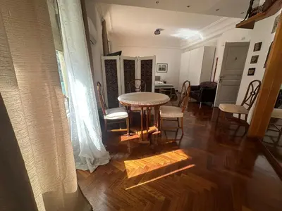a dining room with a table and chairs in a room at My Space in Palermo