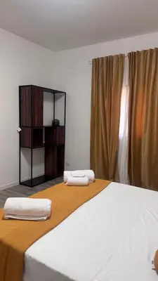 two towels on top of a bed in a room at Cocciu d'amuri a casa in Terrasini