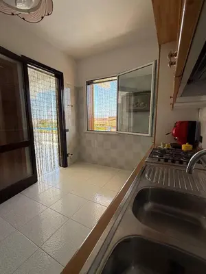 a kitchen with a sink and a counter top at 