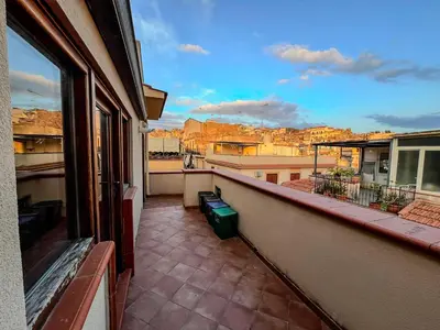 an apartment balcony with a view of a city at Casa Vacanza Acquanuova in Calatafimi