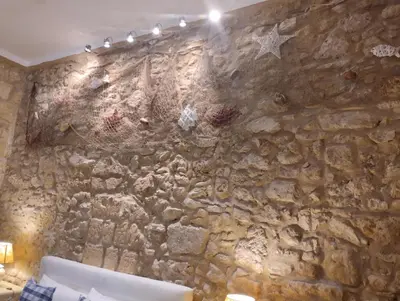 a stone wall in a room with a star on it at Il rustico del pescatore in Balestrate