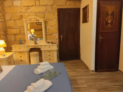 a bathroom with two towels on a table with a mirror at Il rustico del pescatore in Balestrate