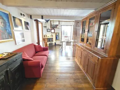 a living room with a red couch in a room at Ciak a Ballarò in Palermo