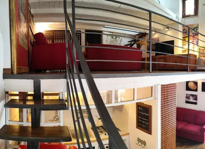 a view of a living room with red furniture at Ciak a Ballarò in Palermo