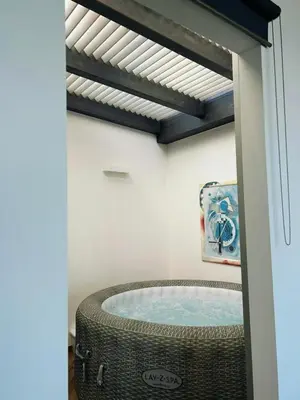 a bathroom with a jacuzzi tub in a room at Villa Mare Luna in Balestrate