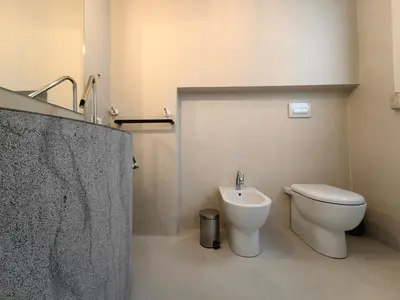 a bathroom with a toilet and a sink at Villa Teleffio in Castellammare del Golfo