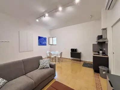 a living room with a couch and a table at Almarè Mondello in Mondello