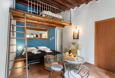 a room with two beds and a mirror at Paradise Rooms B&B in Palermo