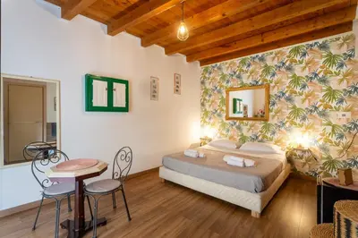 a bathroom with a toilet and a shower and a sink at Paradise Rooms B&B in Palermo