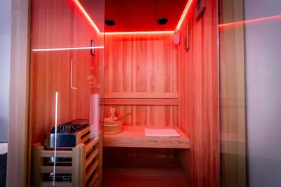 a small kitchen with red lights in a room at Palermo Luxury Rooms Black in Palermo