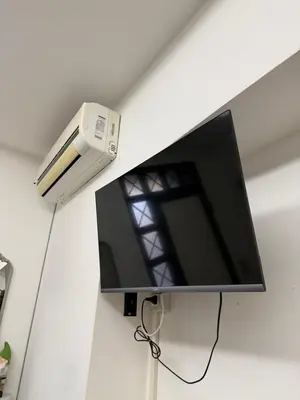 a flat screen tv hanging on a wall at La casa di Tiche in Palermo