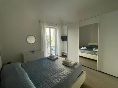 a bedroom with a bed and a large mirror at Dimora Normanna in Palermo