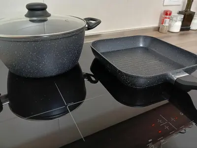a pot on top of a stove in a kitchen at The Junction in Palermo