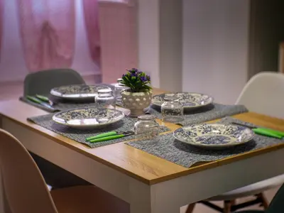 a table with blue and white plates on it at Casa Melina in Palermo