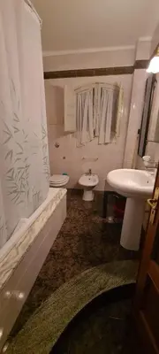a bathroom with a sink and a toilet and a shower at Cottage I Sollazzi in Palermo