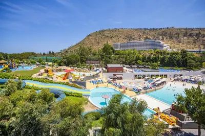 an amusement park with a large pool and a cruise ship at Ombelico di VenereVilla in Mandra Capreria