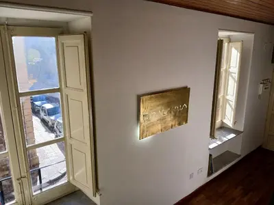 a room with a window and a picture on the wall at Ballaria Pop Art in Palermo