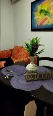 a table in a living room with a vase on it at A 2 passi dal Politeama in Palermo