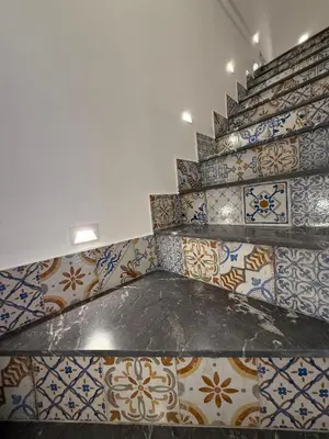 a room with many different types of tiles on the wall at VUCCIRIA' S ROOM centro storico in Palermo