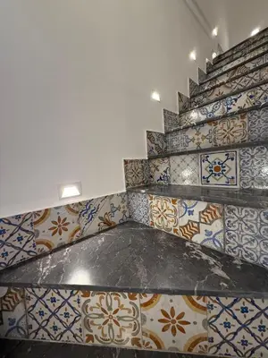 a room with many different types of tiles on the wall at VUCCIRIA' S ROOM centro storico in Palermo