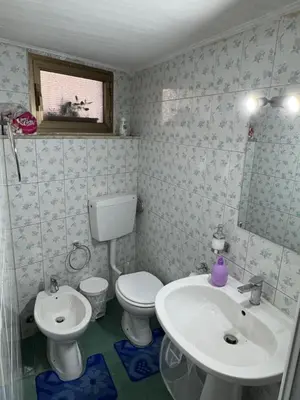 a bathroom with a toilet and a sink at Casa la Fenice in Palermo