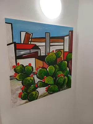 a painting of a cactus on a wall at Studio 23 in Partinico