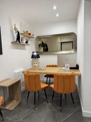 a dining room with a table and chairs at Borbon Home luxury rooms & SPA in Palermo