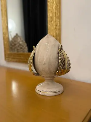 a vase sitting on a table in front of a mirror at Borbon Home luxury rooms & SPA in Palermo