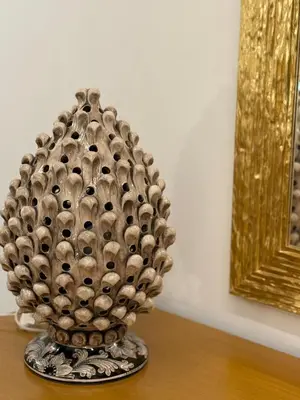 a vase sitting on top of a table at Borbon Home luxury rooms & SPA in Palermo