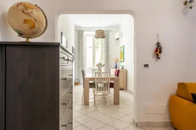 a kitchen with a table and a dining room at A casa di GIO&GRACE in Palermo