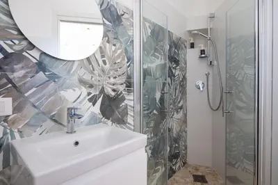 a bathroom with a sink and a shower at Uditore Mini Apartment in Palermo