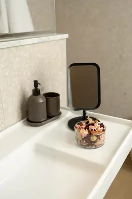 a white counter with a mirror and a bowl on it at Suite80 in Palermo