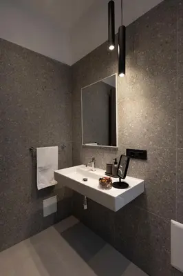 a bathroom with a sink and a mirror at Suite80 in Palermo