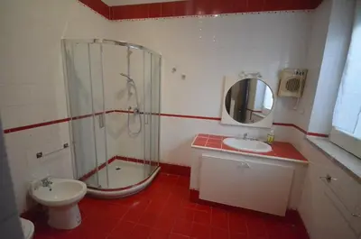 a bathroom with a shower and a sink and a toilet at Villa Cetti a Mondello in Palermo