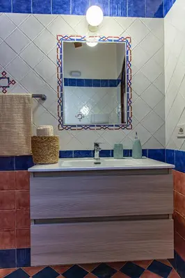 a bathroom with a sink and a mirror at Villa Luna Scopello in Castellammare del Golfo
