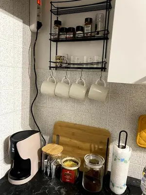 a kitchen counter with a counter top with a mixer and a counter top at La Casetta di Fortunata in Palermo