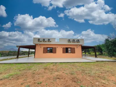 a small house in a field with a sky at Apartment MareLuce by Interhome in Balestrate