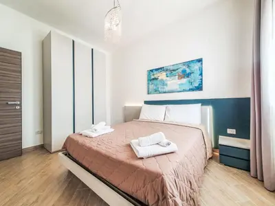 a bedroom with a bed with two towels on it at Apartment MareLuce by Interhome in Balestrate
