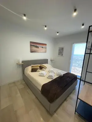 a bedroom with a large bed in a room at Da Andrea in Carini