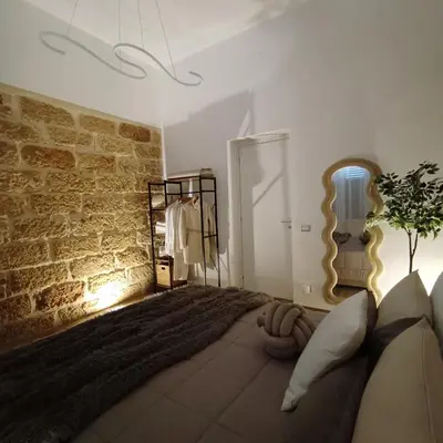 a hair dryer with a brush and a hair dryer at Mr White's House Apartment in Palermo