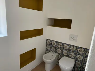 a bathroom with a toilet and a bidet at Appartamento la Noce in Palermo