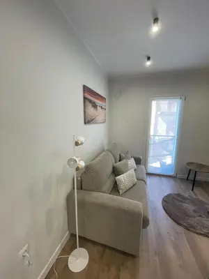 a living room with a couch and a table at Gold Rooms in Carini