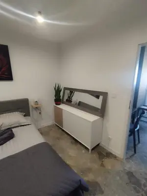 a bedroom with a bed and a mirror on the wall at Da Pietro in Carini