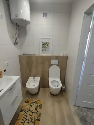 a bathroom with a white toilet and a sink at Da Pietro in Carini